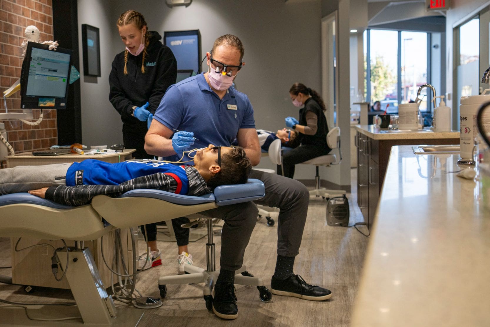 Dr. Greg working on a patient